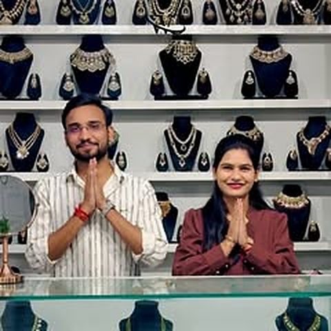The team with the jewellery wall at the store