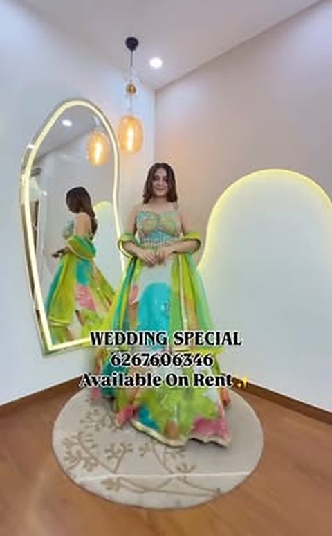 Mint and rani lehenga in the studio